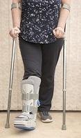 Image of a woman using crutches to walk